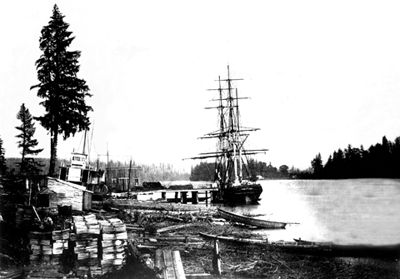 sailing ship loading lumber in Canada