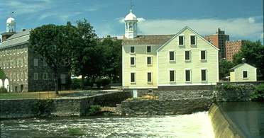Slater Mill with waterfall in front