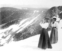 women in skirts on a
            snowy mountain