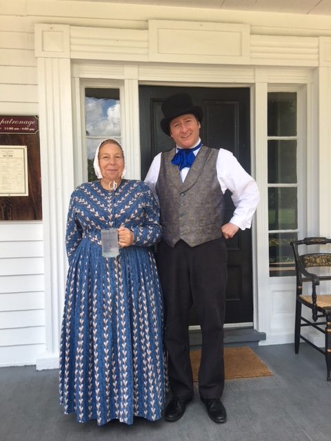 two costumed interpreters at Eagle
          Tavern